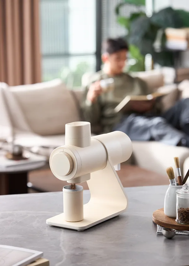 Barsetto E6Air cream grinder on a table in a home living room