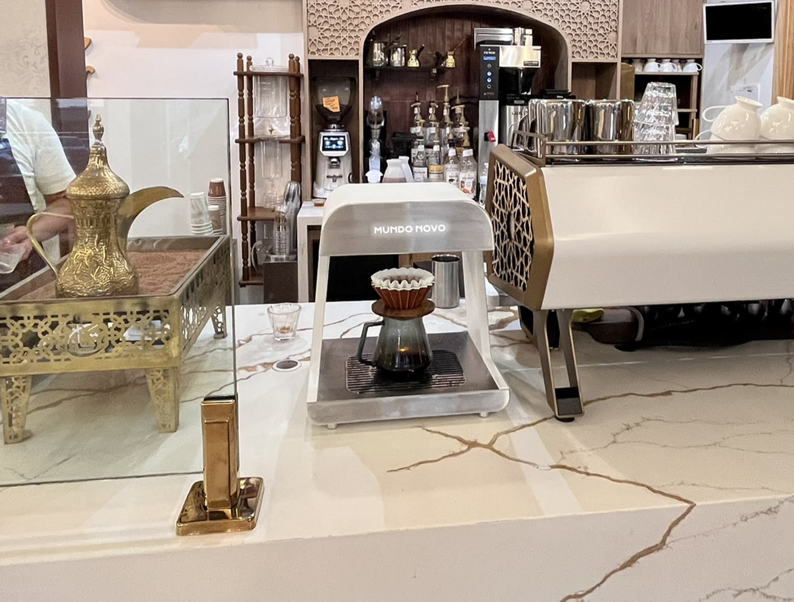Mundo Novo automated pour-over machine installed at a cafe counter, no barista training required